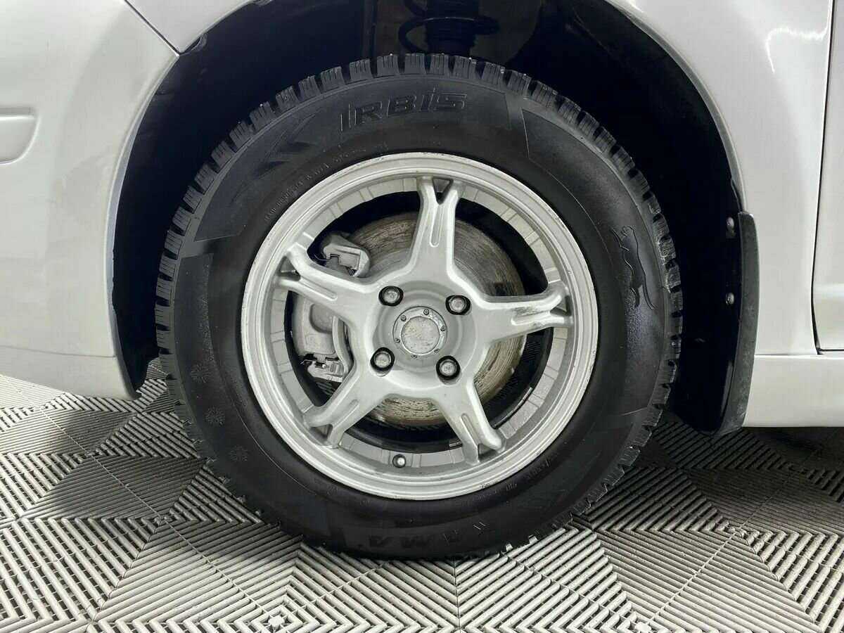 Nissan Tiida 2011 года с пробегом. Фото: #15